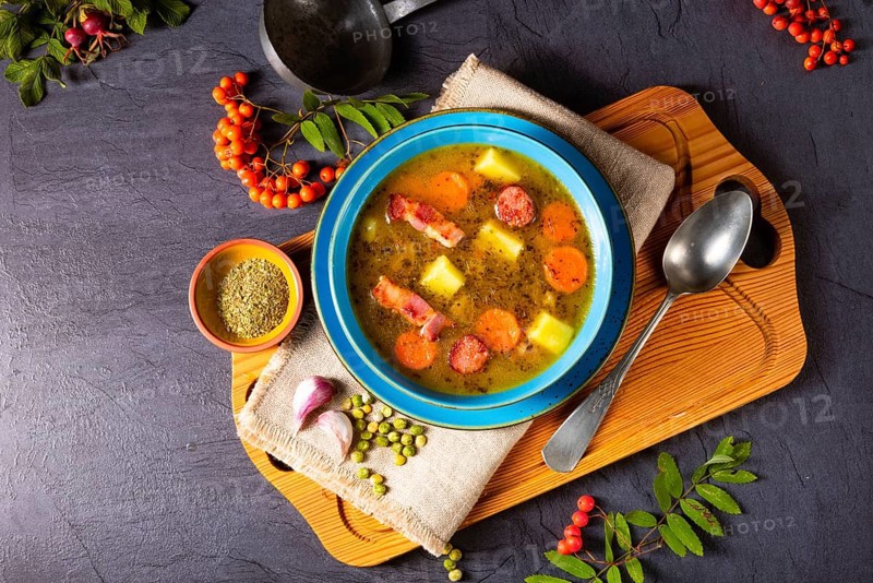 Polish pea soup (grochowka) with smoked bacon and sausage
