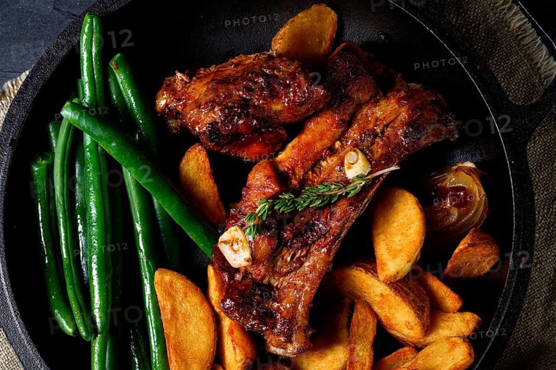 Pork with beans and quarter potatoes
