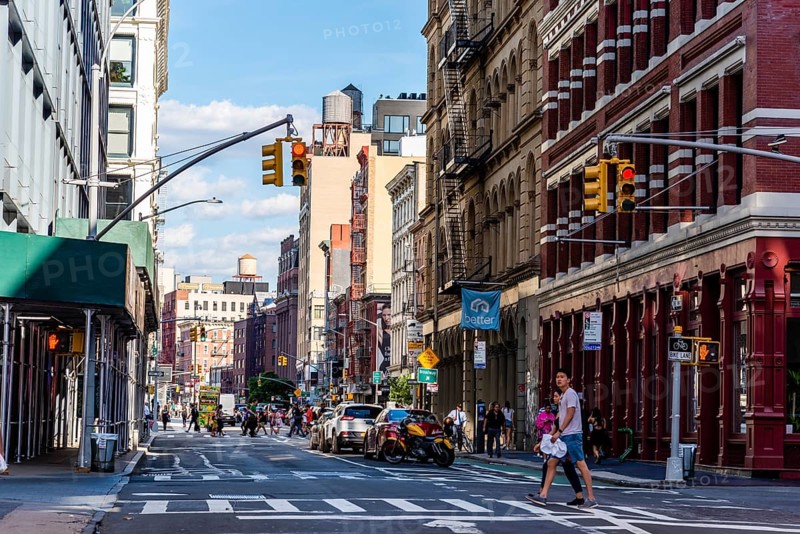 New York City, USA, June 25, 2018: Street with luxury fashion retail stores in Soho Cast Iron historic District in New York City