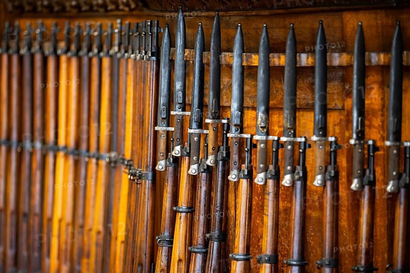 Old wood riffles with bayonets on them