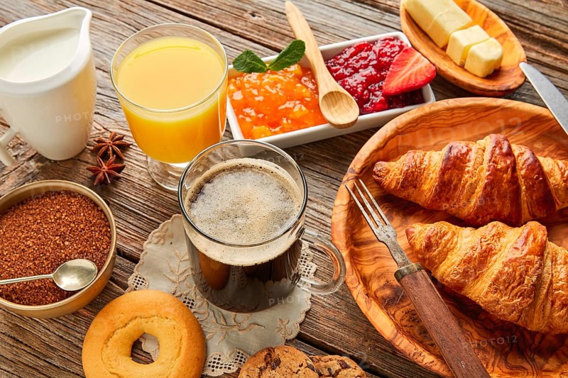 Breakfast continental with croissant coffe and orange juice