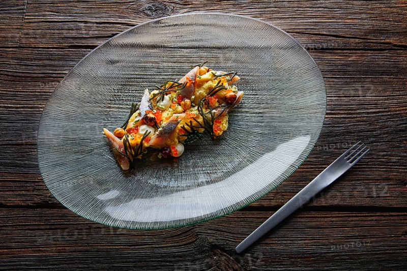 Smoked sardines salad with creamy cheese corn codium and hazelnuts