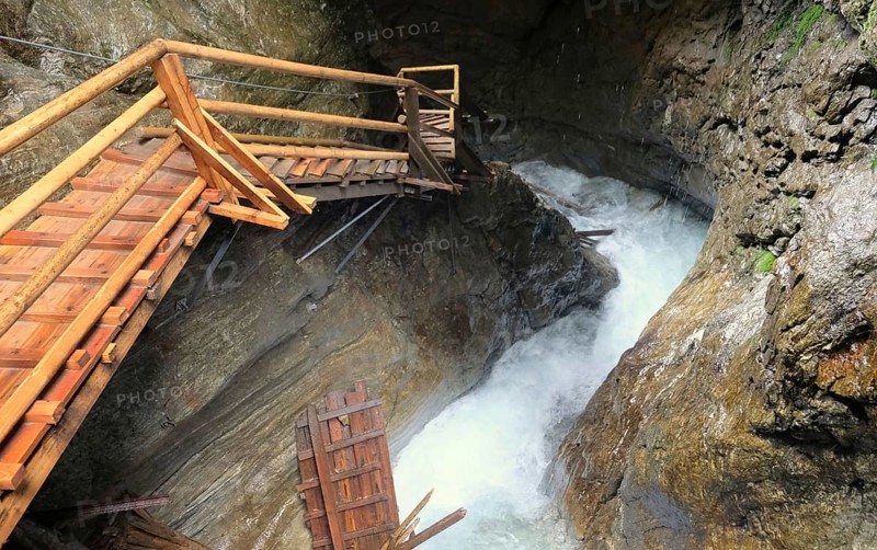 Steep stairs along waterfall and rocks in austria ragaslucht