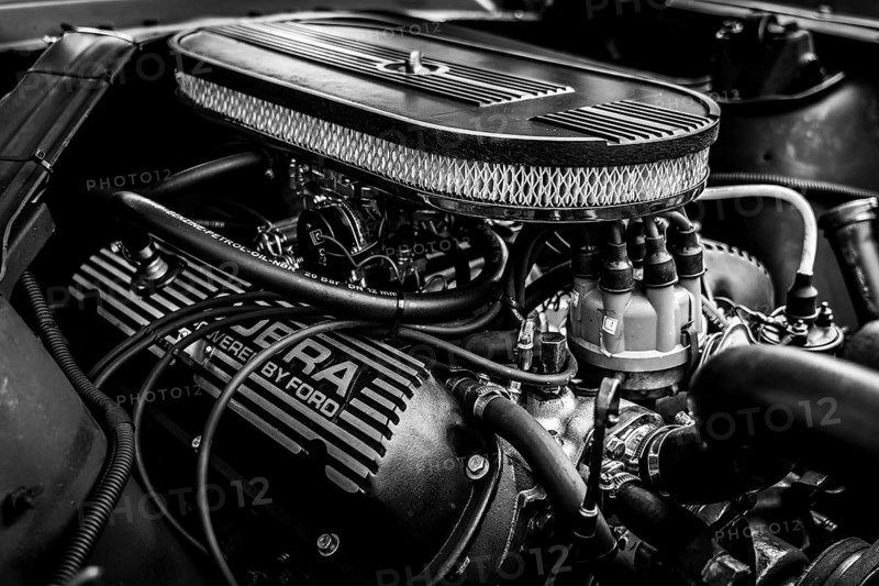 DIEDERSDORF, Germany - AUGUST 30, 2020: The engine of pony car Ford Mustang (first generation) . The exhibition of US Car Classics. Black and white