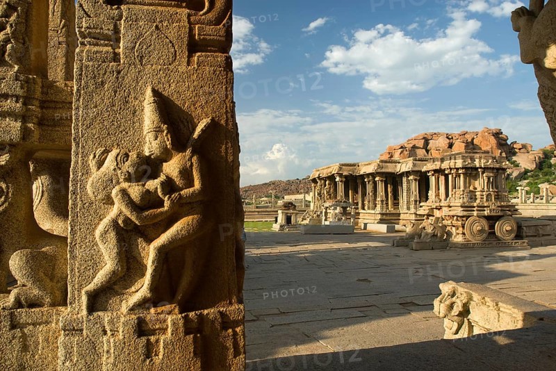 Erotic panel on pillar in Kalyana Mandapa and Stone Chariot in Vitthala temple, Hampi, Karnataka, India