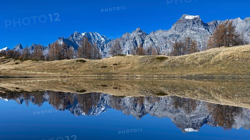 Majestic mountain landscape reflected in the calm lake under a clear sky, Pizzo Cornera 3083 m, Monte Cervandone 3210 m, Laghi del Sangiatto, Alpe Devero, Val d'Ossola, Province of Verbano-Cusio-Ossola, Piedmont, Italy