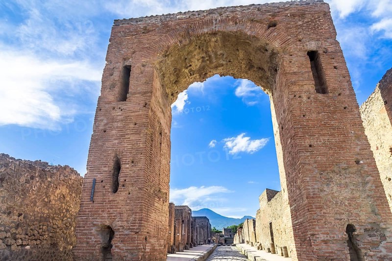 Pompeii in Italy, ruins of the antique Temple of Apollo with bronze Apollo statue, Naples