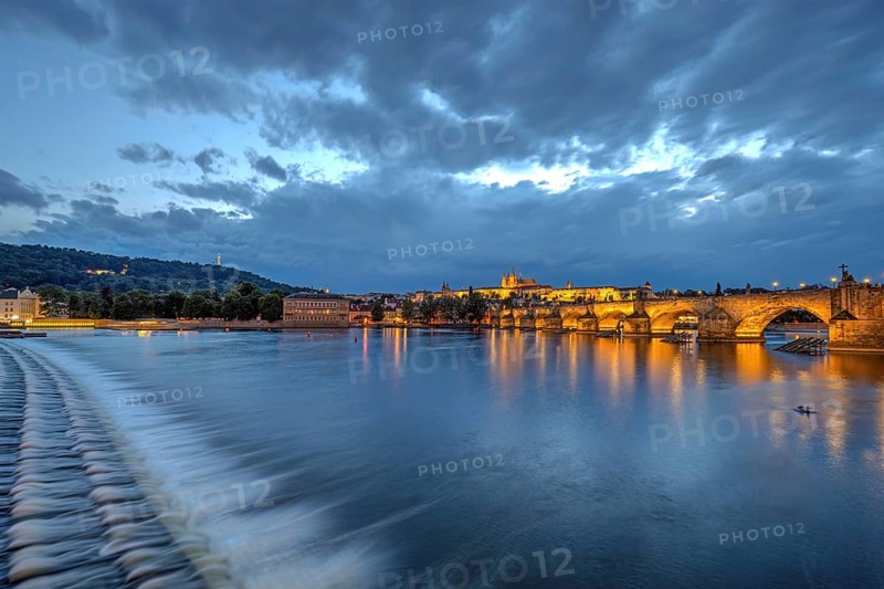 The famous Charles Bridge and Hradcany Castle in Prague at dusk