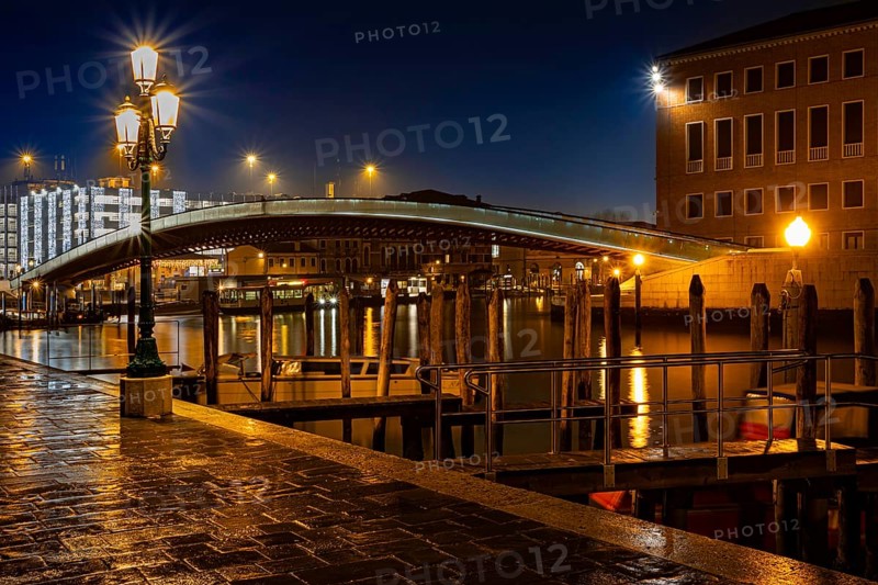 Illuminated bridge over the Grand Canal with lanterns and jetties at night, Fondamenta S. Simeon Piccolo, Venice, Veneto region, Italy