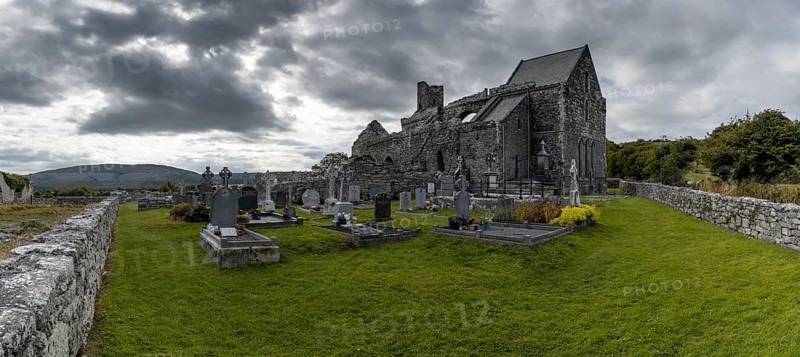 Ballyvaughan, Ireland, 28 July, 2022: panorama view of the historic 13th-century Corcomroe Abbey and cemetery in County Clare