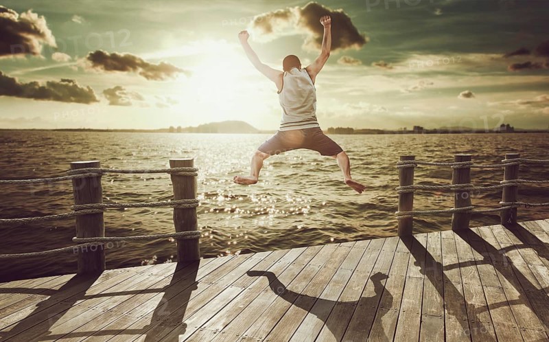 Cliff Jumping into the Ocean at Sunset, Summer Fun Lifestyle