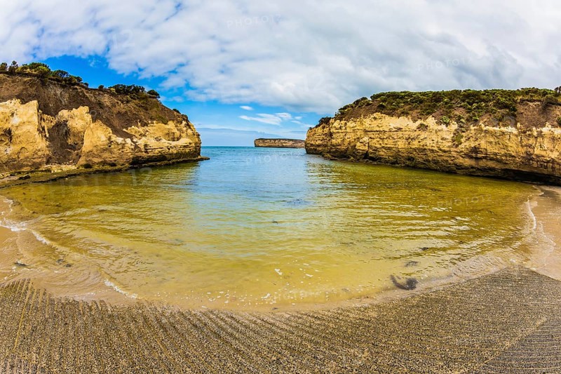 Great Ocean Road of Australia. Picturesque seashore, coastal cliffs and sandy beaches of the Pacific. The concept of exotic, active and photo-tourism