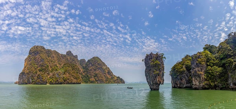 A colorful picture of the beautiful landscape of the James Bond Island and its iconic islet