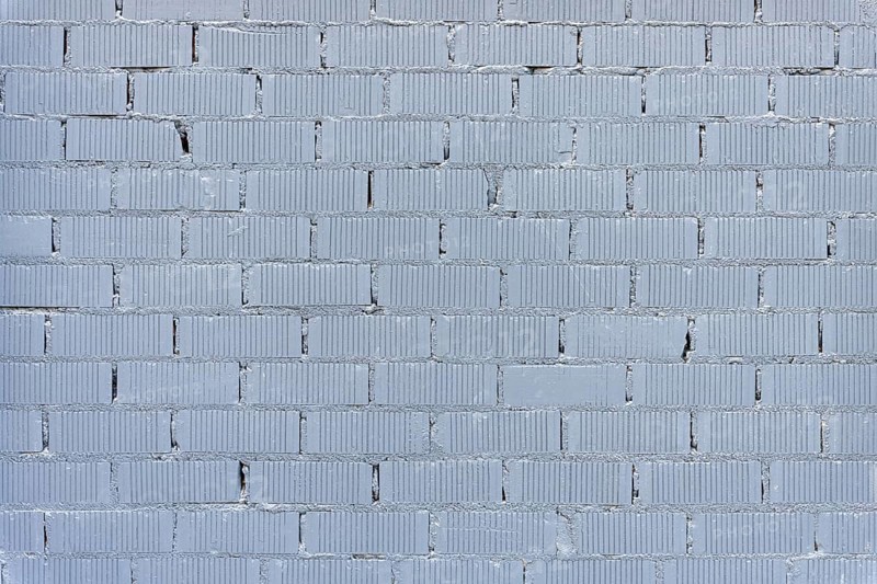 Background consisting of a wall of grey painted bricks