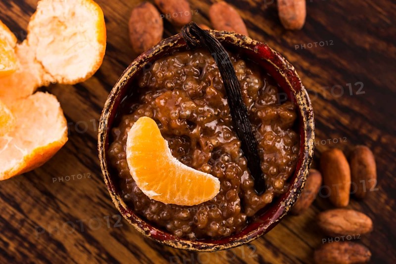 A bowl of chocolate tapioca pudding with fruits