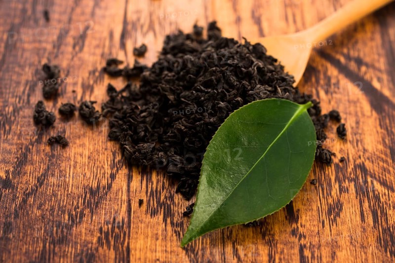Dry tea and green leaves