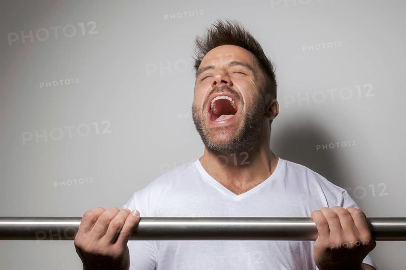 An image of a bearded bodybuilding man