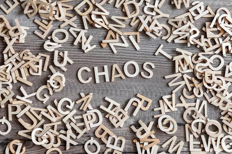 An image of some wooden letters and the word chaos