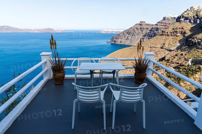 Table and armchair, viewpoint on the crater rim, Fira, Santorini Island, Cyclades, Greece