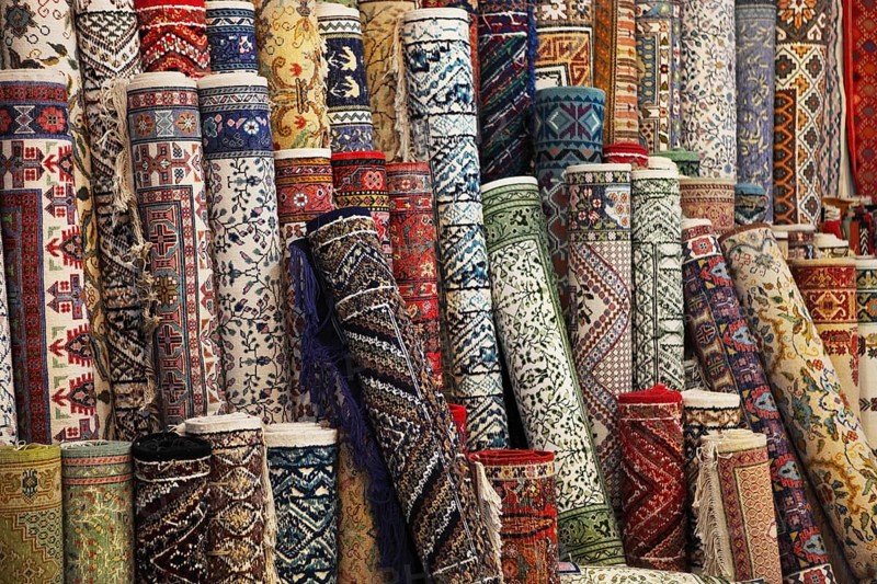 Many colorful carpets in the store. Background