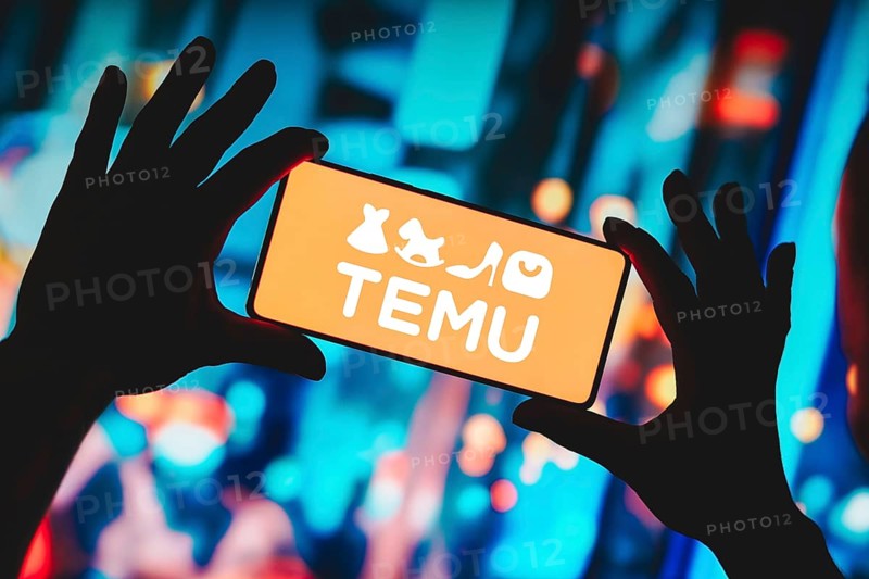 In this photo illustration, the Temu logo is displayed on a smartphone screen