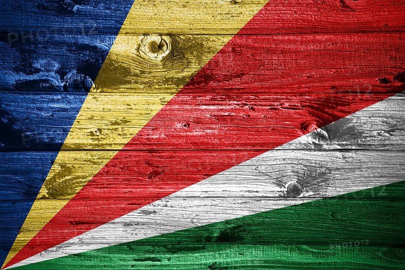 Seychelles flag on wooden planks background wood flag