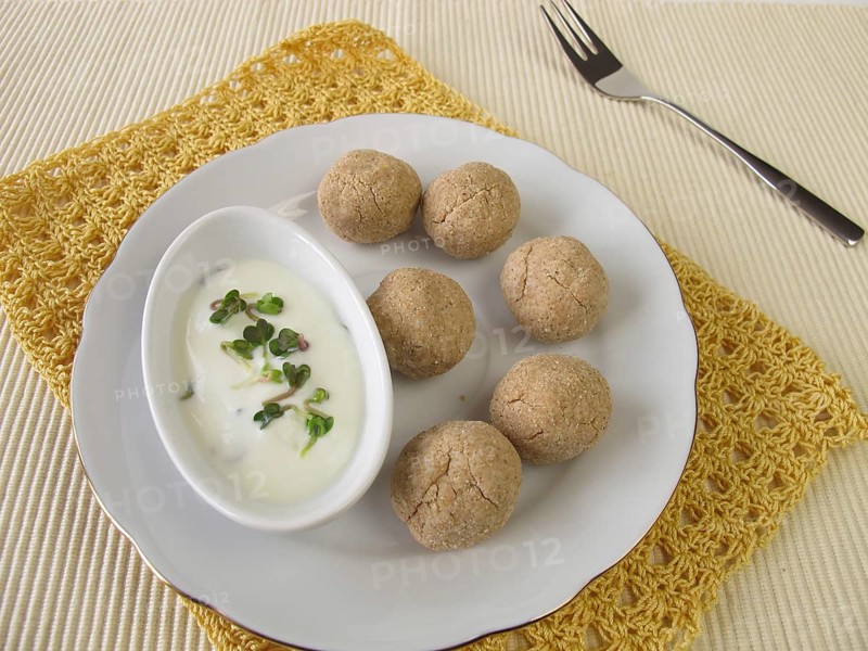 Tsampa balls with yoghurt and radish sprouts