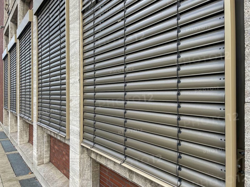 Windows with lowered shutters