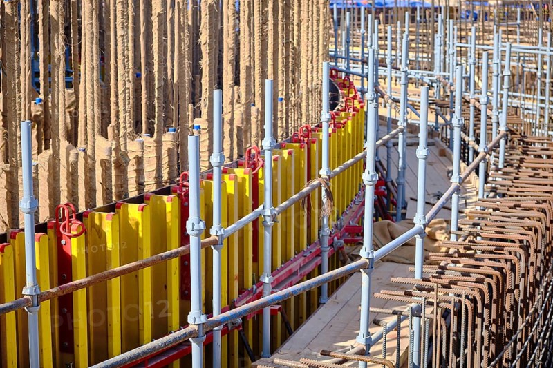 Vertical panel formwork and scaffoldings of reinforced concrete walls under construction. Structures for cast in place reinforced concrete