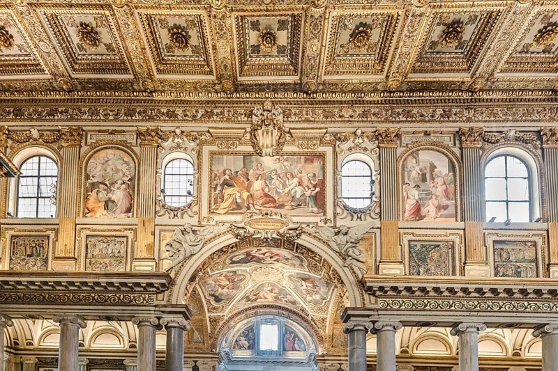 Coffered ceiling of the right aisle with a view into the domed chapel of the capella sistina of the Basilica of Santa Maria Maggiore in Rome, Italy