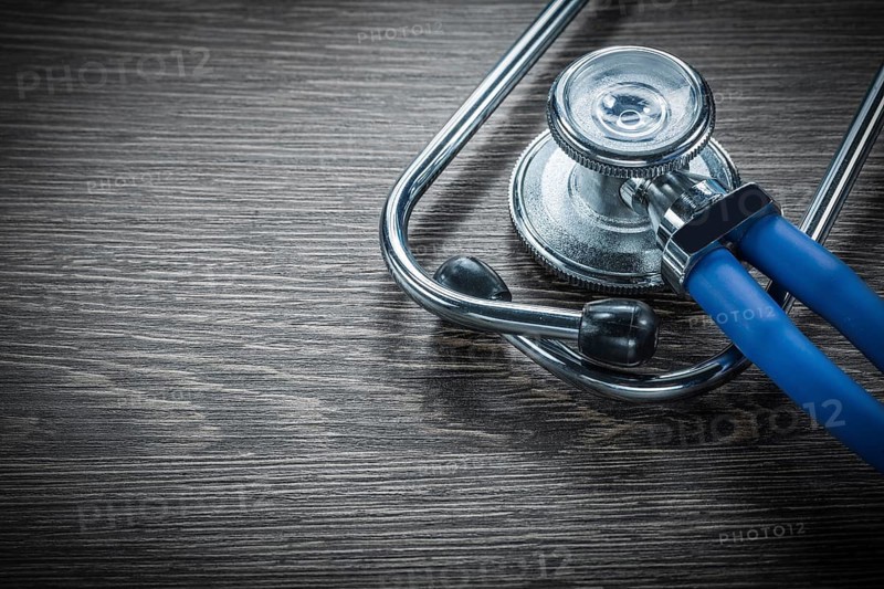 Stethoscope on vintage wooden board
