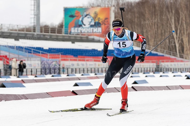 Sportswoman biathlete Eremeeva Elizaveta Kamchatsky Krai skiing on distance biathlon complex. Open regional youth biathlon competitions East Cup. Kamchatka Peninsula, Russian Far East, Apr 12, 2019