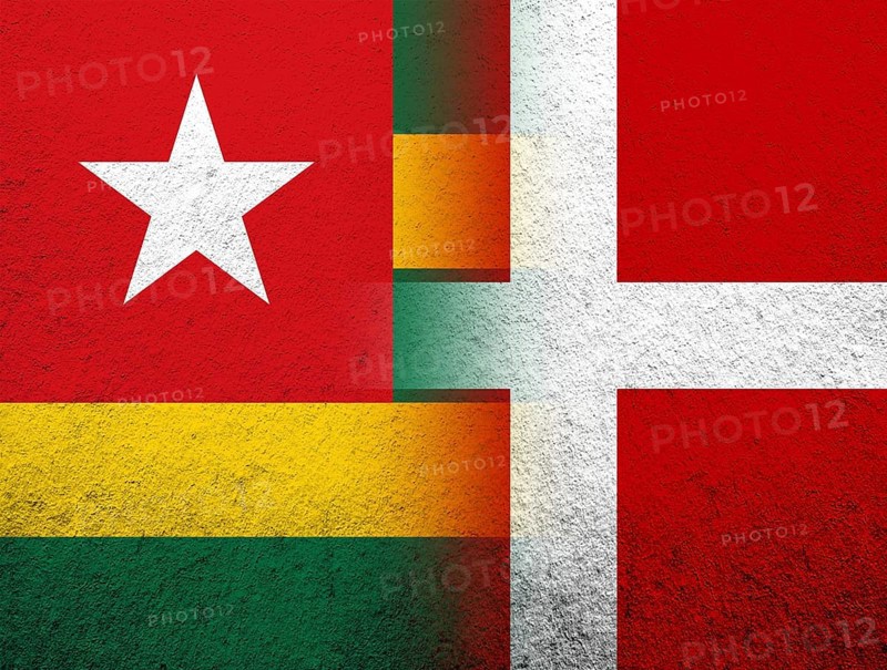 The Kingdom of Denmark National flag with The Togolese Republic Togo National flag. Grunge Background