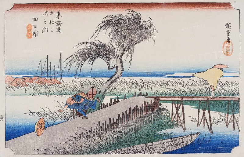 Yokkaichi: The hurricane. A man racing after his hat, bowled along by the wind, and another crossing a small bridge over a stream, his coat blown about him.<br/><br/> Yokkaichi Station was not only a port, but also a thriving market town. The name Yokkaichi literally means 'fourth day market' and is derived from the traditional market held on the fourth day of each month at this town. Travellers had to cross a series of tiny bridges built over the small rivers flowing through low level land along the seashore.<br/><br/> Utagawa Hiroshige (?? ??, 1797 – October 12, 1858) was a Japanese ukiyo-e artist, and one of the last great artists in that tradition. He was also referred to as Ando Hiroshige (?? ??) (an irregular combination of family name and art name) and by the art name of Ichiyusai Hiroshige (?????).<br/><br/> The Tokaido (??? East Sea Road) was the most important of the Five Routes of the Edo period, connecting Edo (modern-day Tokyo) to Kyoto in Japan. Unlike the inland and less...