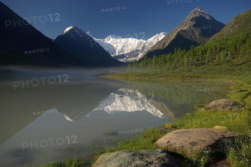 Beautiful mountain landscape near the lake. Mountain Lake. Kind of mountainous terrain and the water in the valley