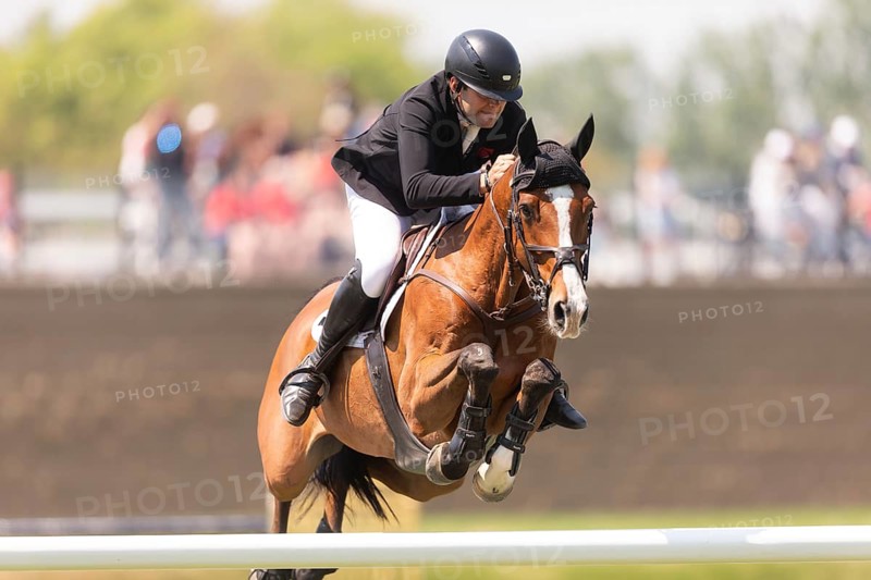 Charlie Jones of Great Britain and riding Capitale 6, compete in the 1.60m Grand Prix during The Continental international competition at Spruce Meadows, in Calgary, Canada, North America