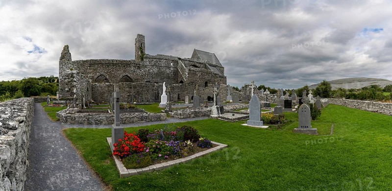 Ballyvaughan, Ireland, 28 July, 2022: panorama view of the historic 13th-century Corcomroe Abbey and cemetery in County Clare