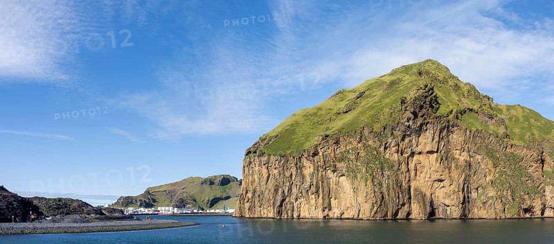 Harbour entrance to the harbour town of Heimaey, steep rocky cliffs, panoramic view, Westman Islands, Iceland