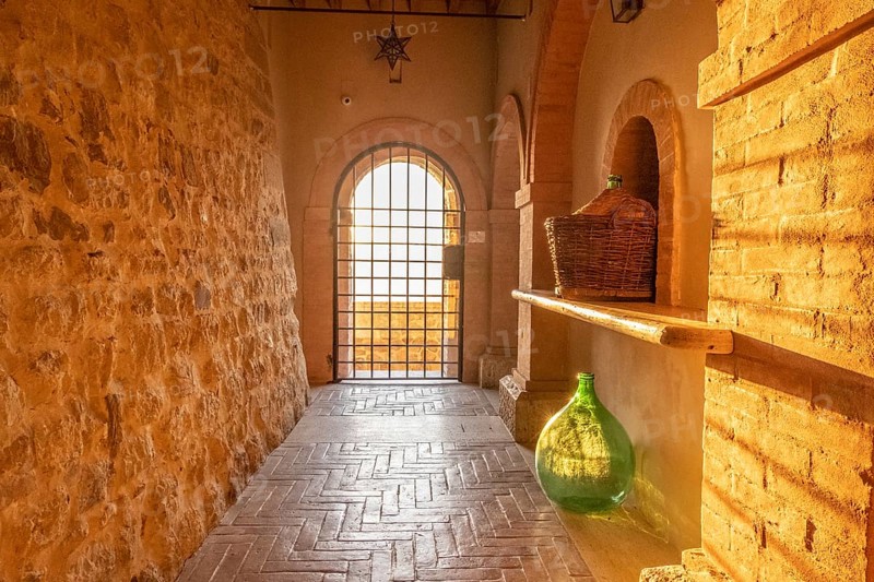 Beautiful sun light inside of an ancient castle near Montalcino, Tuscany, Italy. Old stone medieval castle