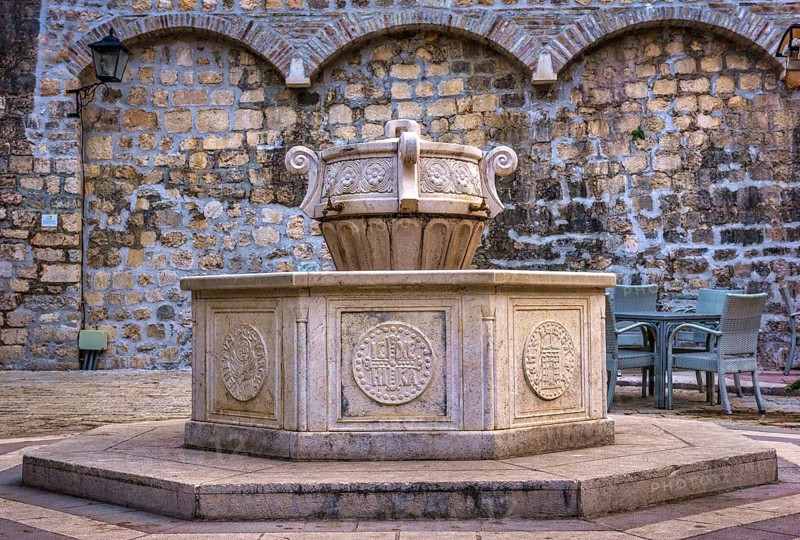 Old fountain near Saint Mary Collegiate church in Kotor