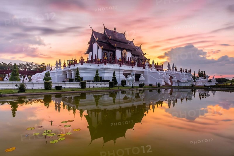 Royal Pavilion and its reflection in pond at Royal Flora Ratchaphruek park. Colorful sky in the morning. Chiang Mai, Thailand