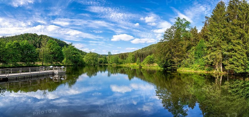 View at a lake in the Spiesswoogtal valley near the German village Fischbach bei Dahn in the Rhineland-Palatinate View at a lake in the Spiesswoogtal valley near the German village Fischbach bei Dahn in the Rhineland-Palatinate