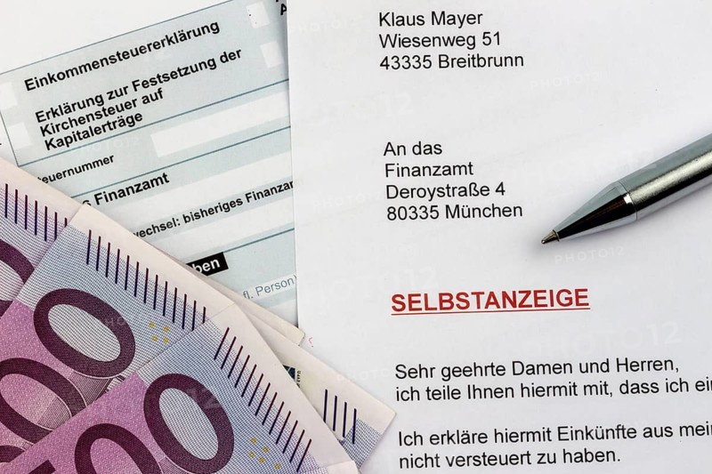 Symbolic photo for a voluntary disclosure for tax evasion at the tax office in Germany Austria