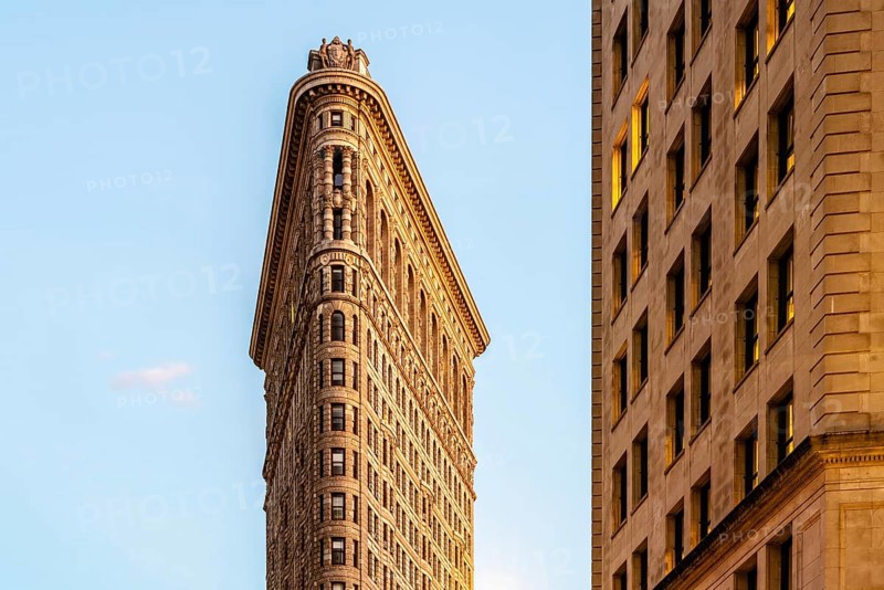 Low angle view of Flatiron Building in Manhattan against blue sky