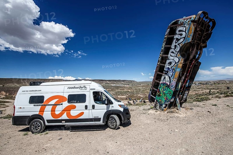 Motorhome and scrap cars decorated with graffiti in the Carforest of Goldfield, Nevada, USA