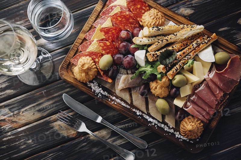 food still-life, Cheese, meat, grapes and olives antipasto