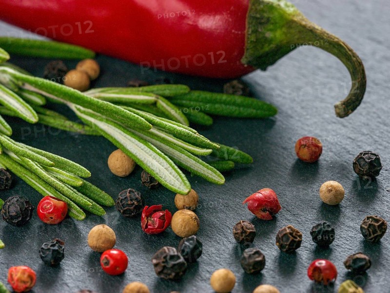 Herbs and spices over slate background. Top view or flat lay. Food background