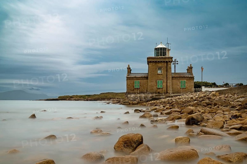 A long exposure view of the historic 19th-century Blacksod Lighthouse on the Mullet Peninsula in County Mayo in Ireland