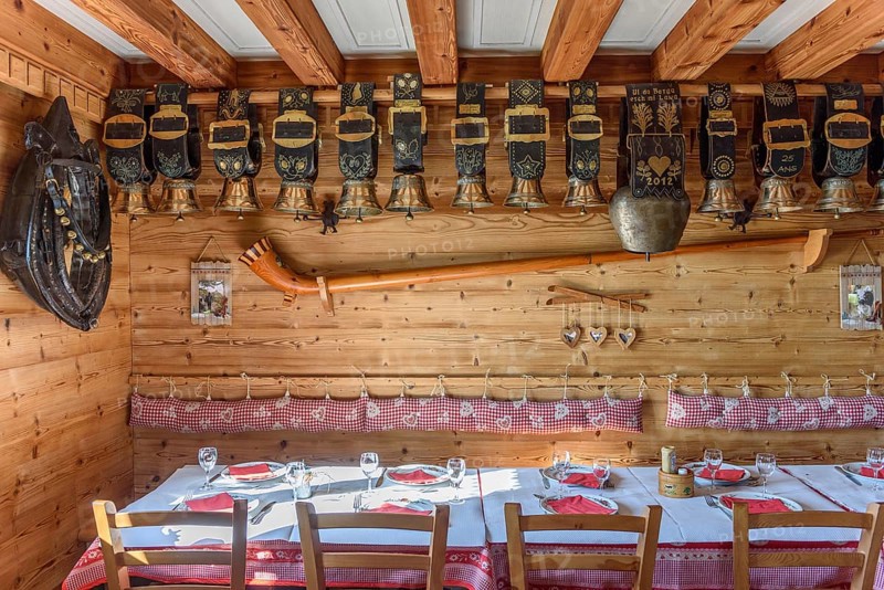 Cow bells displayed in restaurant of mountain farm. Vosges, Alsace, France