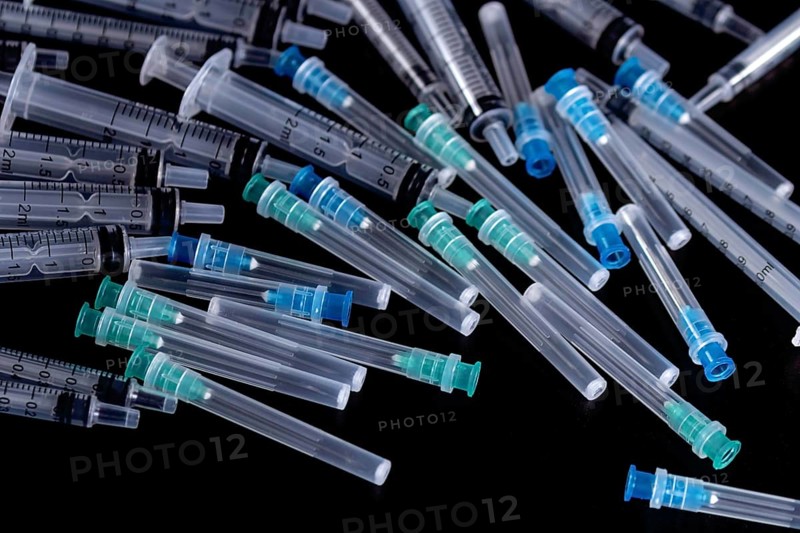 Medical Sterile Syringes Needles, Close up Syringes on Black Background